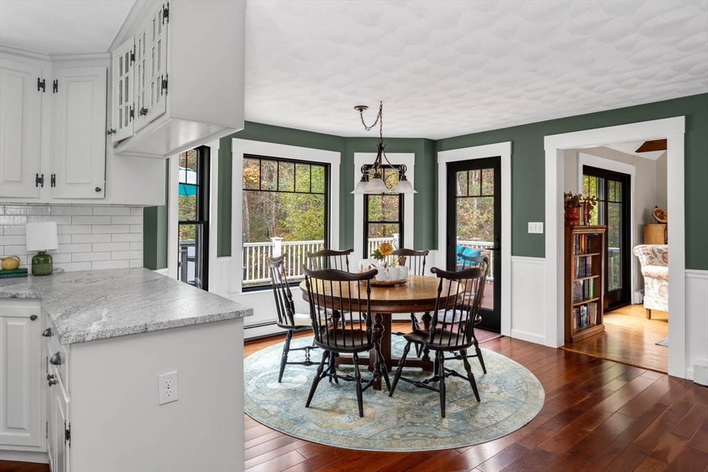 8 Bubbling Brook Road Franklin, MA 02038 - Photo 8 of 46 a view of a dining room with furniture window and wooden floor