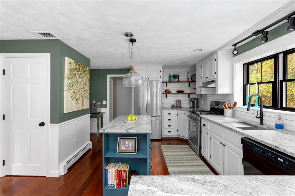 8 Bubbling Brook Road Franklin, MA 02038 - Photo 9 of 46 a kitchen with stainless steel appliances granite countertop a sink stove and refrigerator