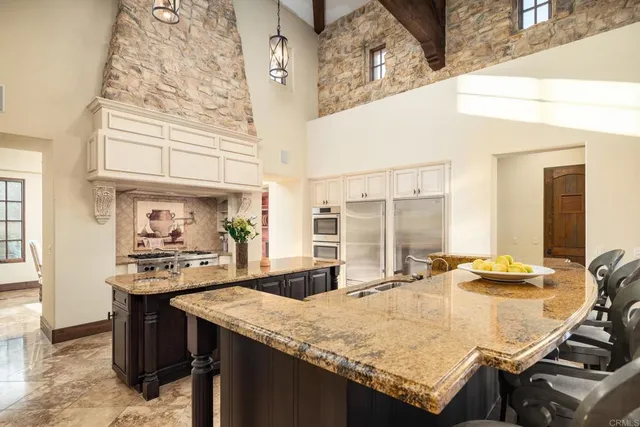 a kitchen with a table and chairs