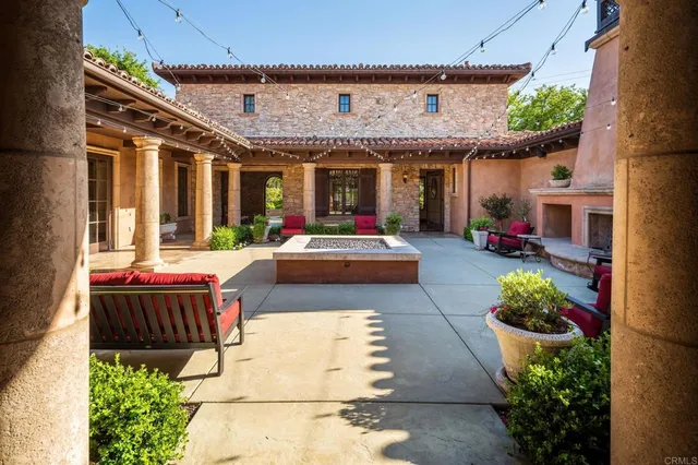 a front view of a house with lots of green space