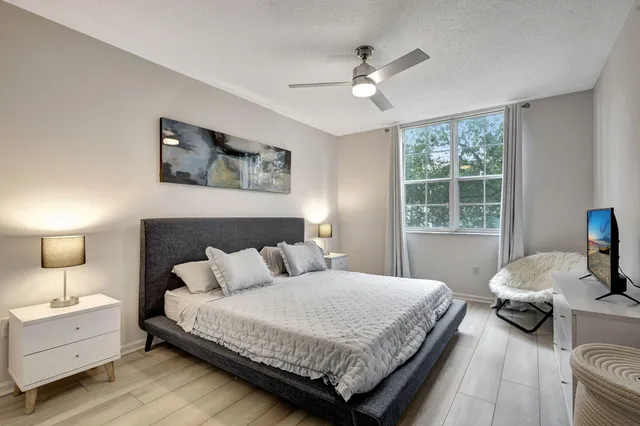 a bedroom with a bed and window