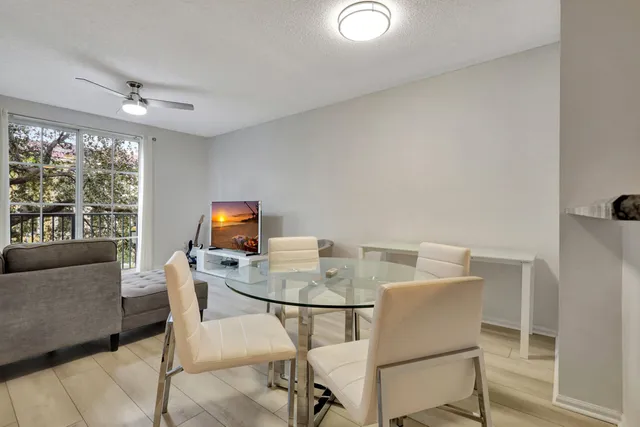 a dining room with furniture and window