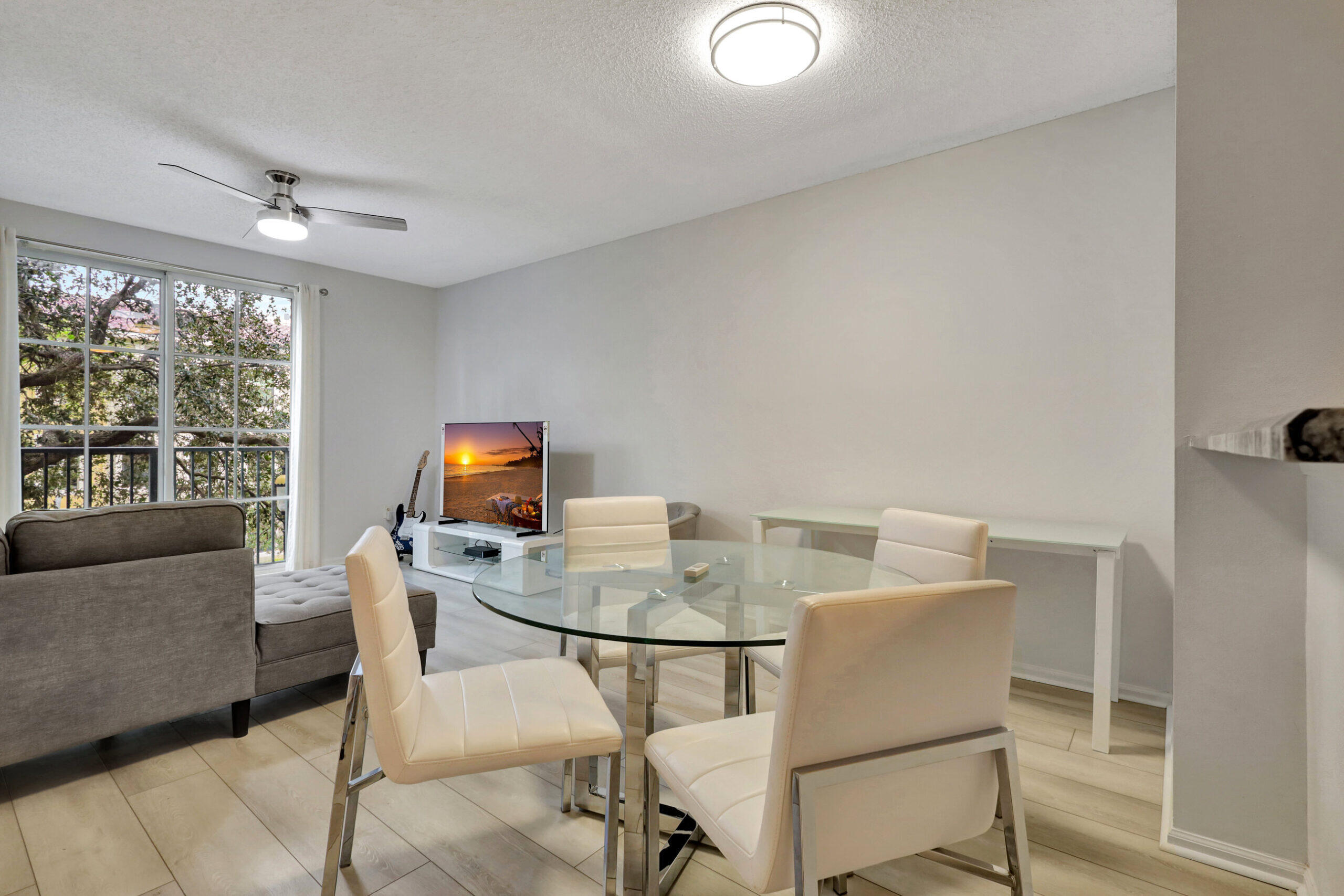 630 South Sapodilla Avenue, Unit 223 West Palm Beach, FL 33401 - Photo 2 of 43 a dining room with furniture and window