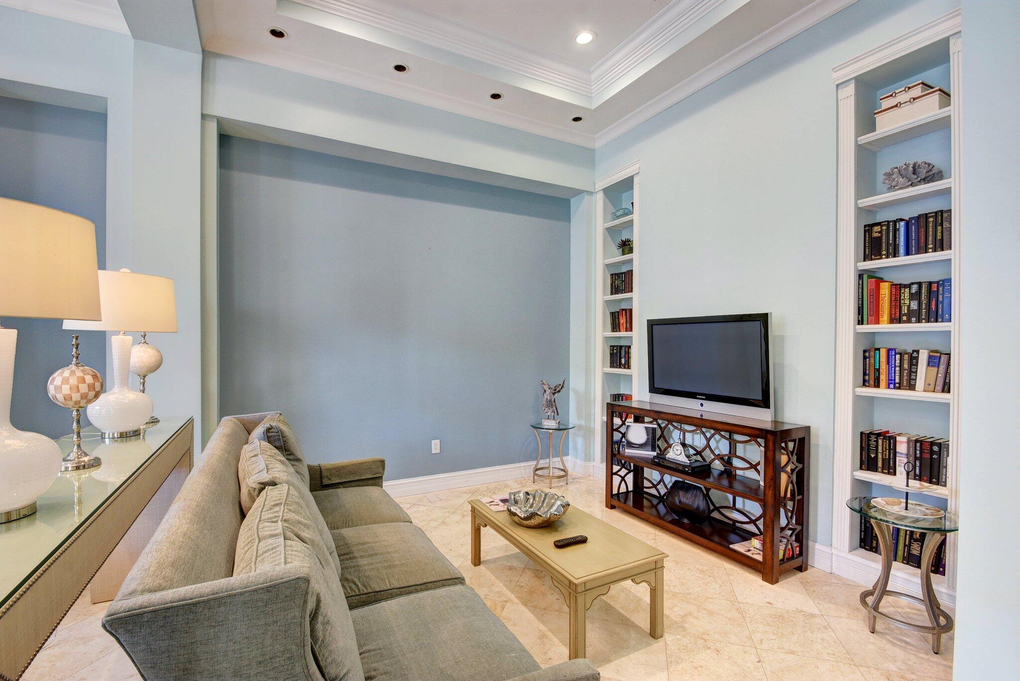 630 South Sapodilla Avenue, Unit 223 West Palm Beach, FL 33401 - Photo 40 of 43 a living room with furniture and a flat screen tv