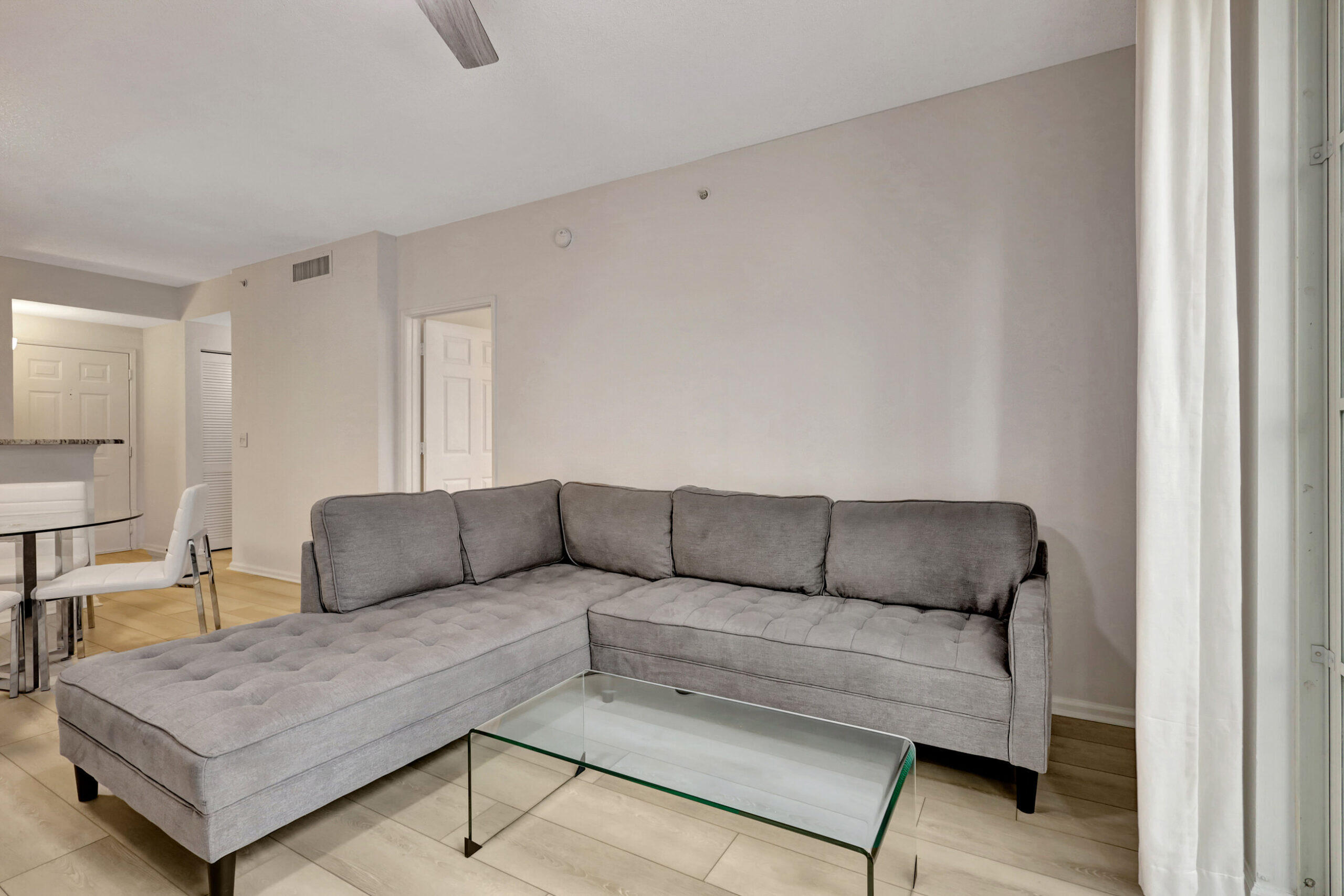 630 South Sapodilla Avenue, Unit 223 West Palm Beach, FL 33401 - Photo 5 of 43 a living room with furniture and a couch