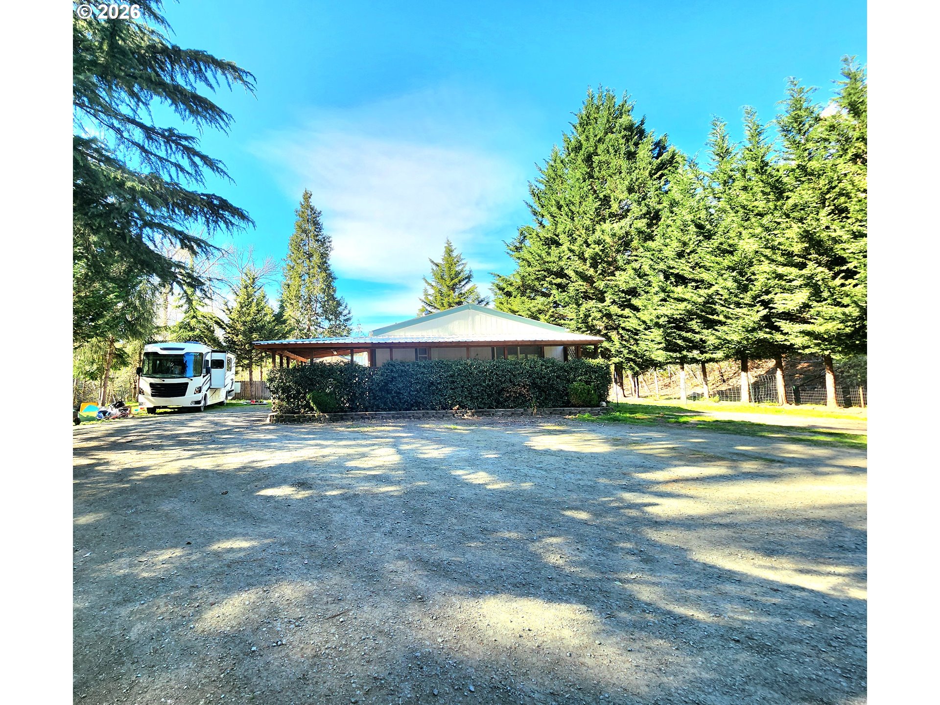 874 South Main Street Canyonville, OR 97417 - Photo 1 of 30 a front view of a house with a yard and trees