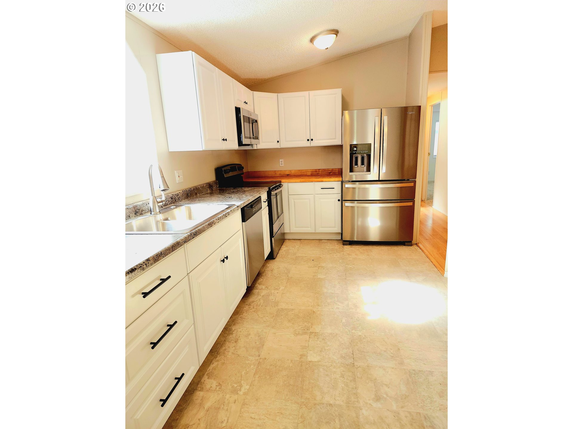 874 South Main Street Canyonville, OR 97417 - Photo 15 of 30 a kitchen with stainless steel appliances a refrigerator sink and cabinets