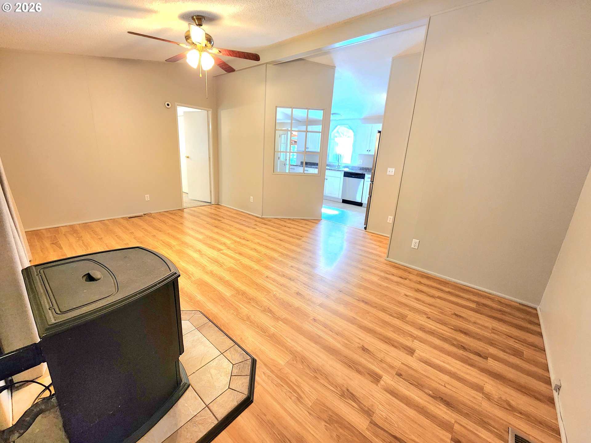 874 South Main Street Canyonville, OR 97417 - Photo 3 of 30 wooden floor in an empty room with a window