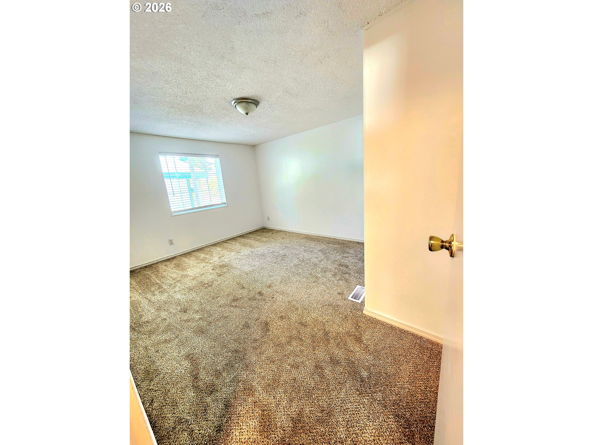 874 South Main Street Canyonville, OR 97417 - Photo 6 of 30 a view of a room with a stylish window and a ceiling fan