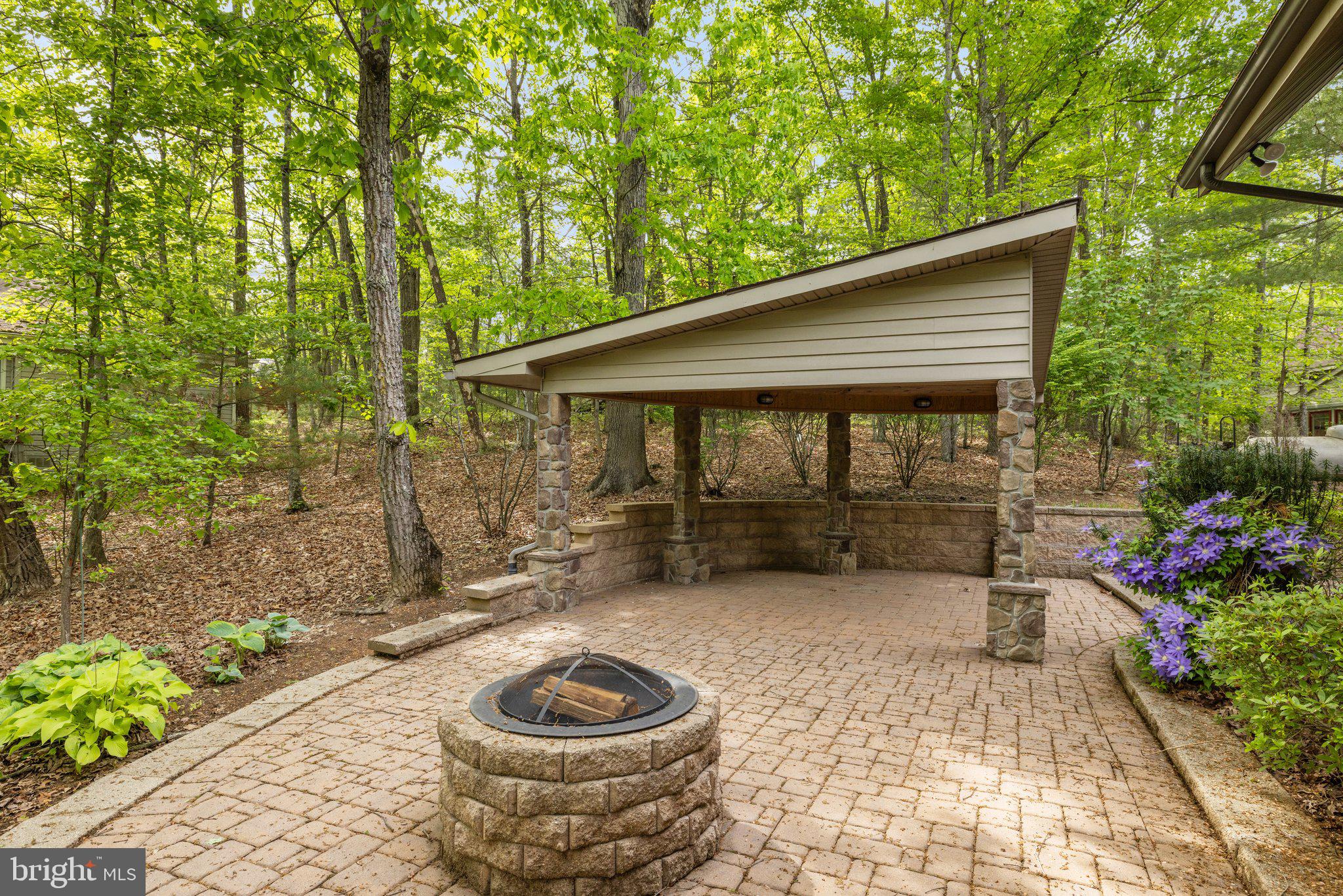 155 Connie Road Basye, VA 22810 - Photo 12 of 76 a backyard of a house with fountain and outdoor seating