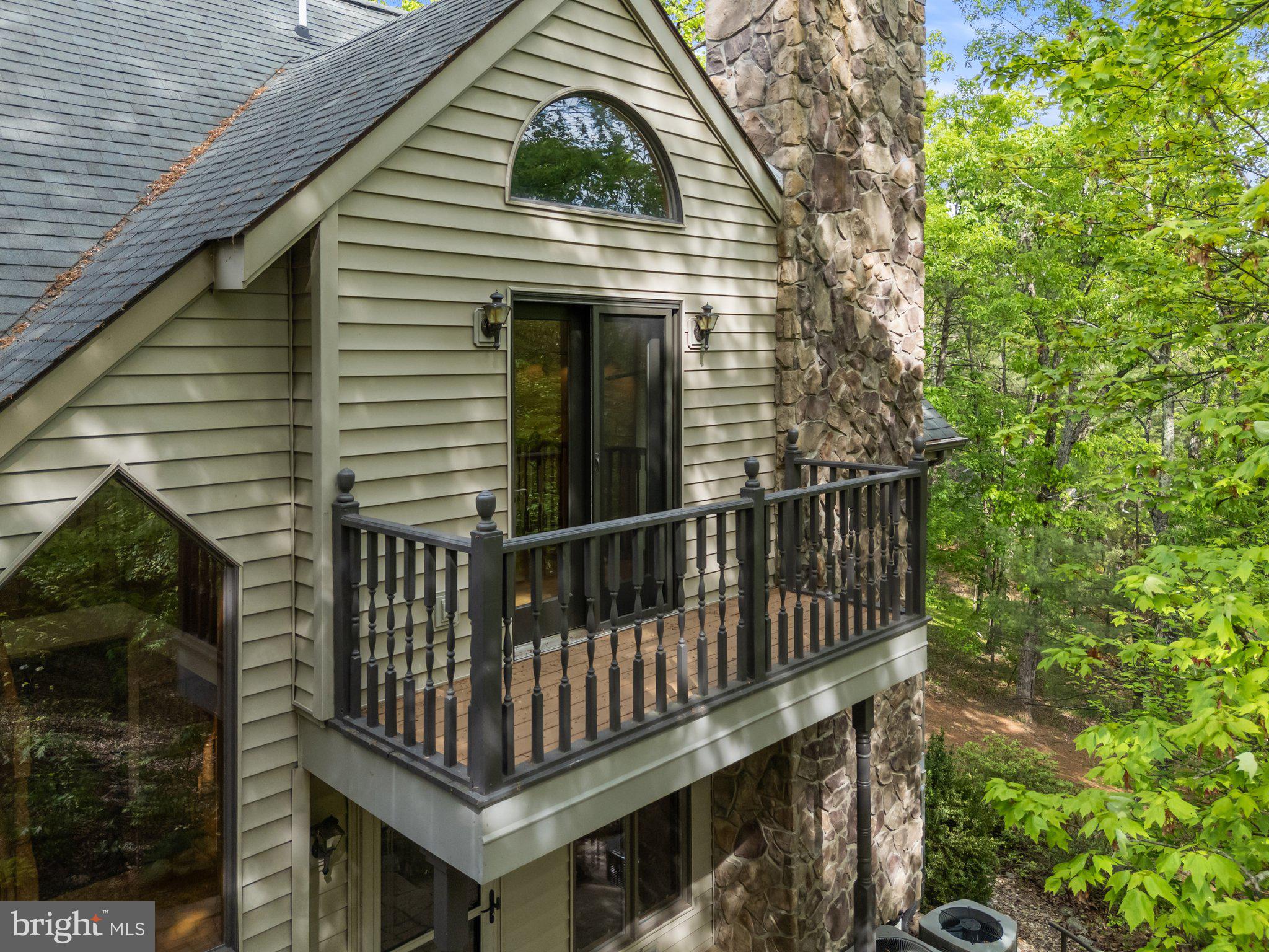 155 Connie Road Basye, VA 22810 - Photo 15 of 76 a view of backyard with deck and outdoor seating