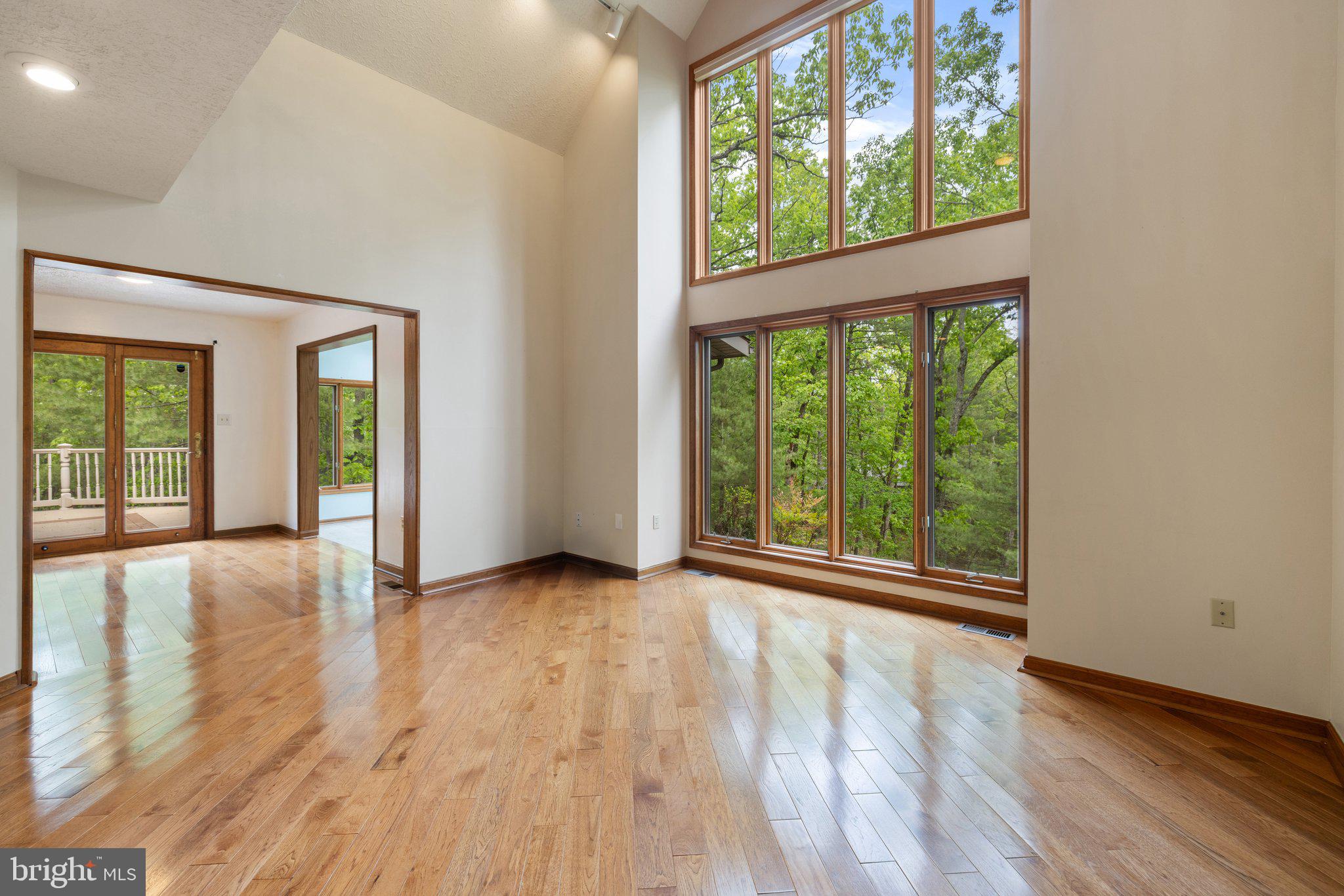 155 Connie Road Basye, VA 22810 - Photo 3 of 76 an empty room with wooden floor and windows