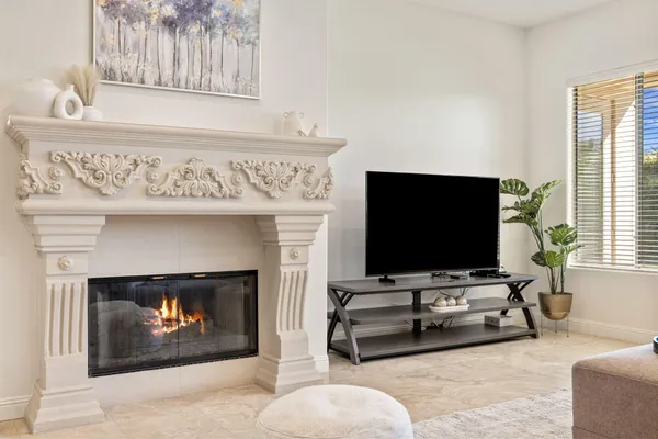a bedroom with two bed and a flat screen tv