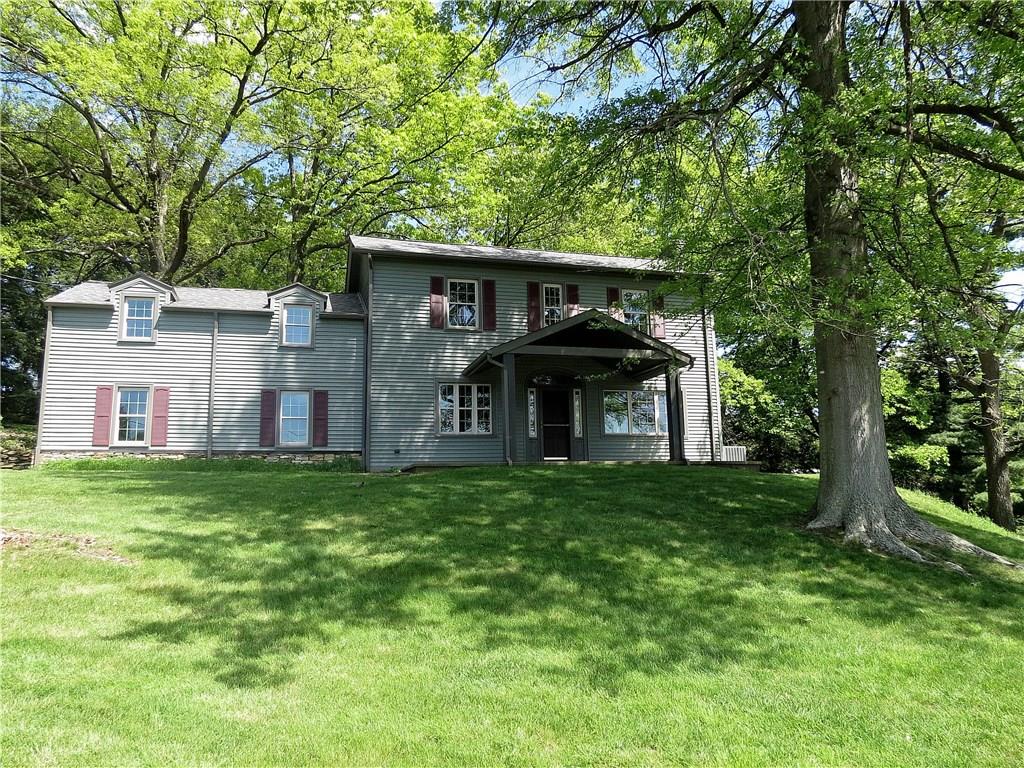 Nestled among the trees, this gracious 4 bedroom 2.5 bath Farmhouse with attached 2 car garage has been beautifully renovated in captivating style!