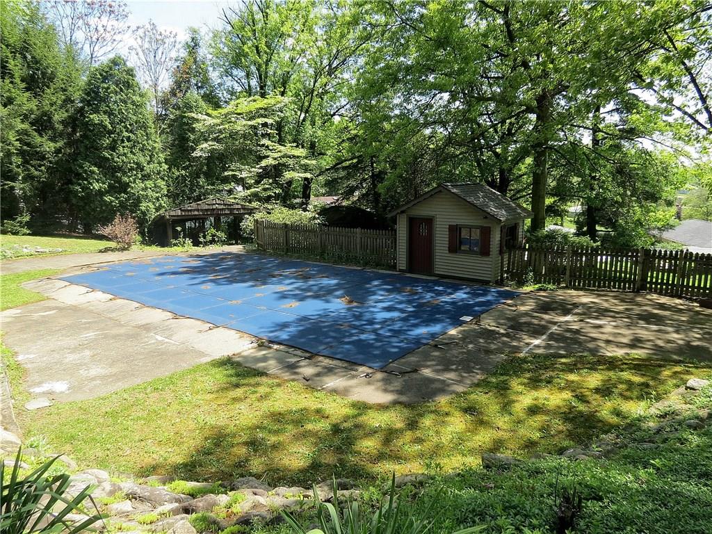 670 Meadow Lane Rochester, PA 15074 - Photo 18 of 21 Spend lazy summer days pool side - the fenced in ground pool is ready for entertaining with a new pool house, new lining, cover & pump.