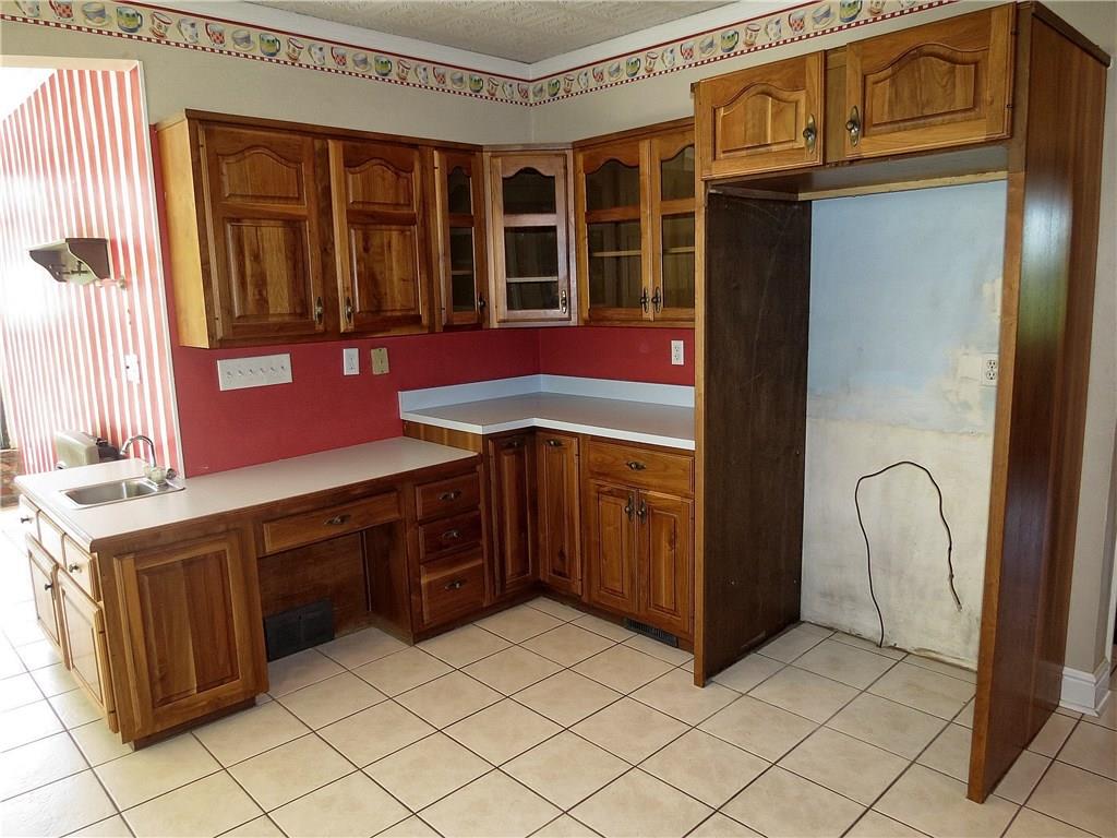 670 Meadow Lane Rochester, PA 15074 - Photo 9 of 21 Another work space can be found in this area of the kitchen with more cabinets and a built-in secretary desk.