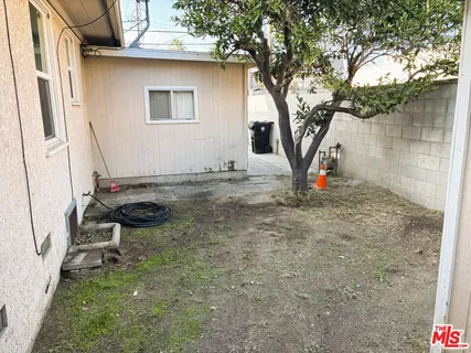 a backyard of a house with seating space