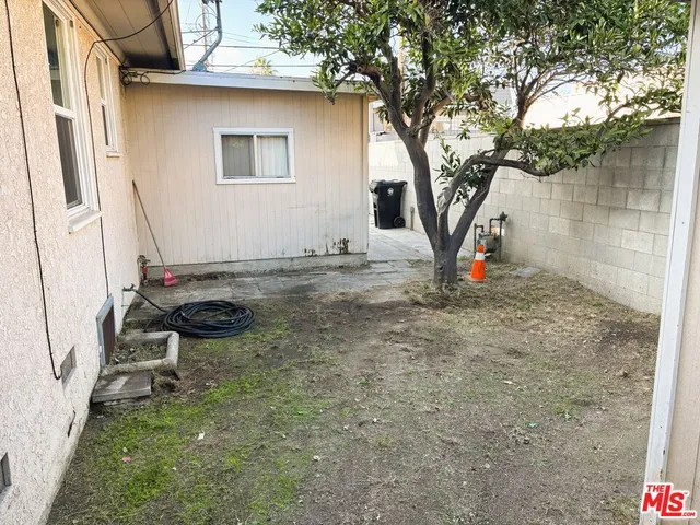 a backyard of a house with seating space