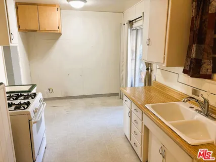 a bathroom with a sink and a washing machine