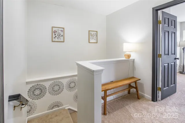 a bedroom with a table and a couch