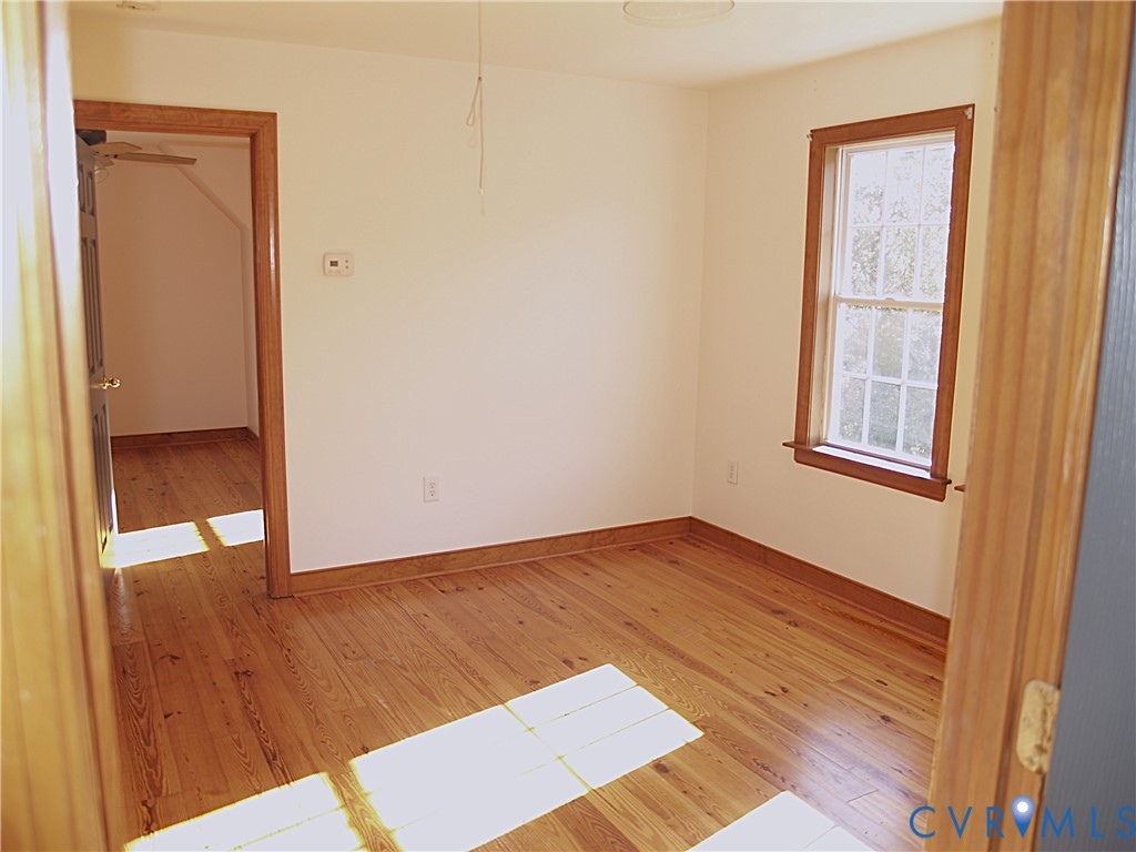 11950 Union Camp Road New Kent, VA 23124 - Photo 13 of 20 an empty room with wooden floor and closet