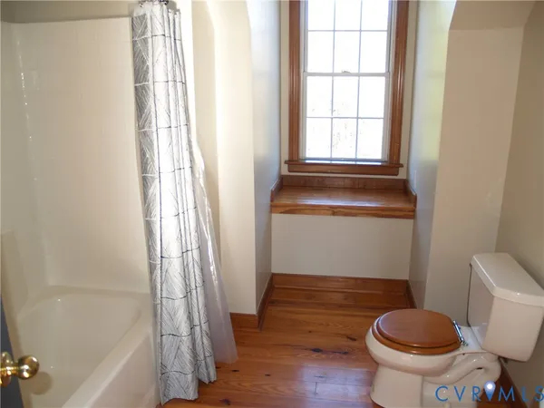 a bathroom with a toilet and a sink
