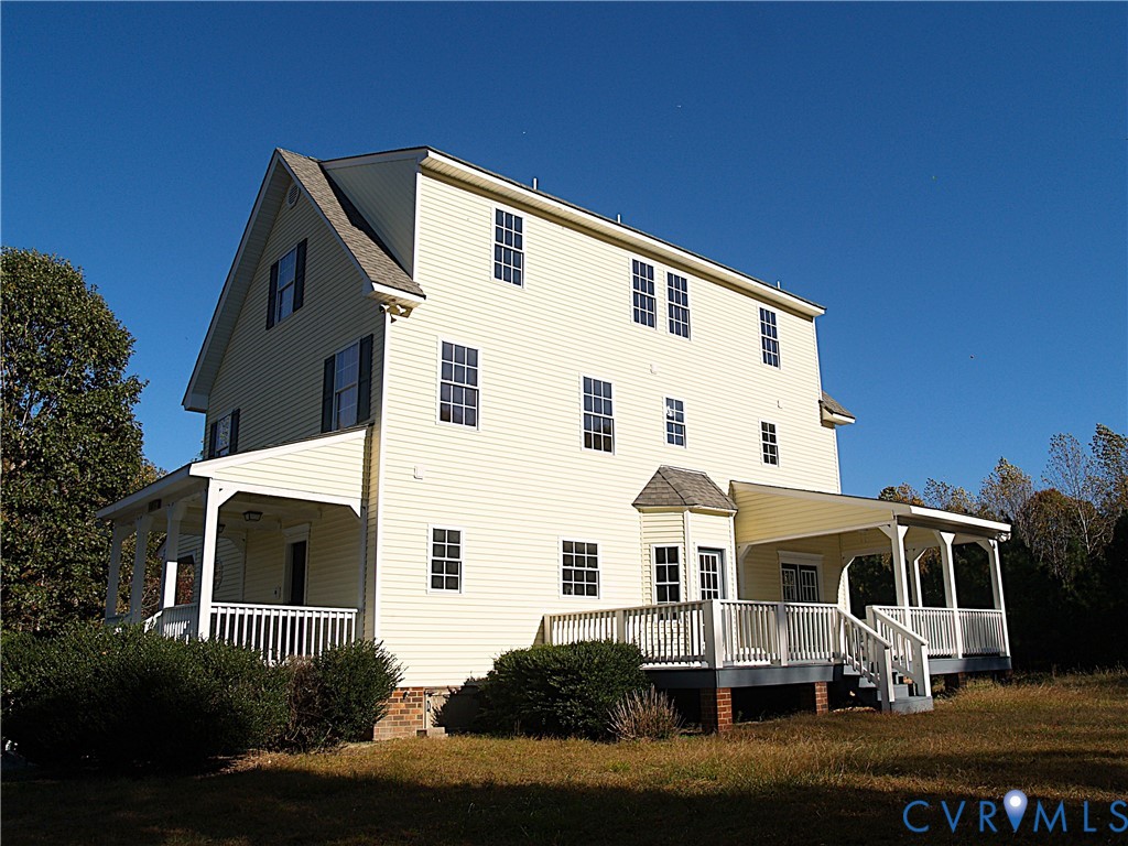11950 Union Camp Road New Kent, VA 23124 - Photo 17 of 20 a front view of a house with a yard