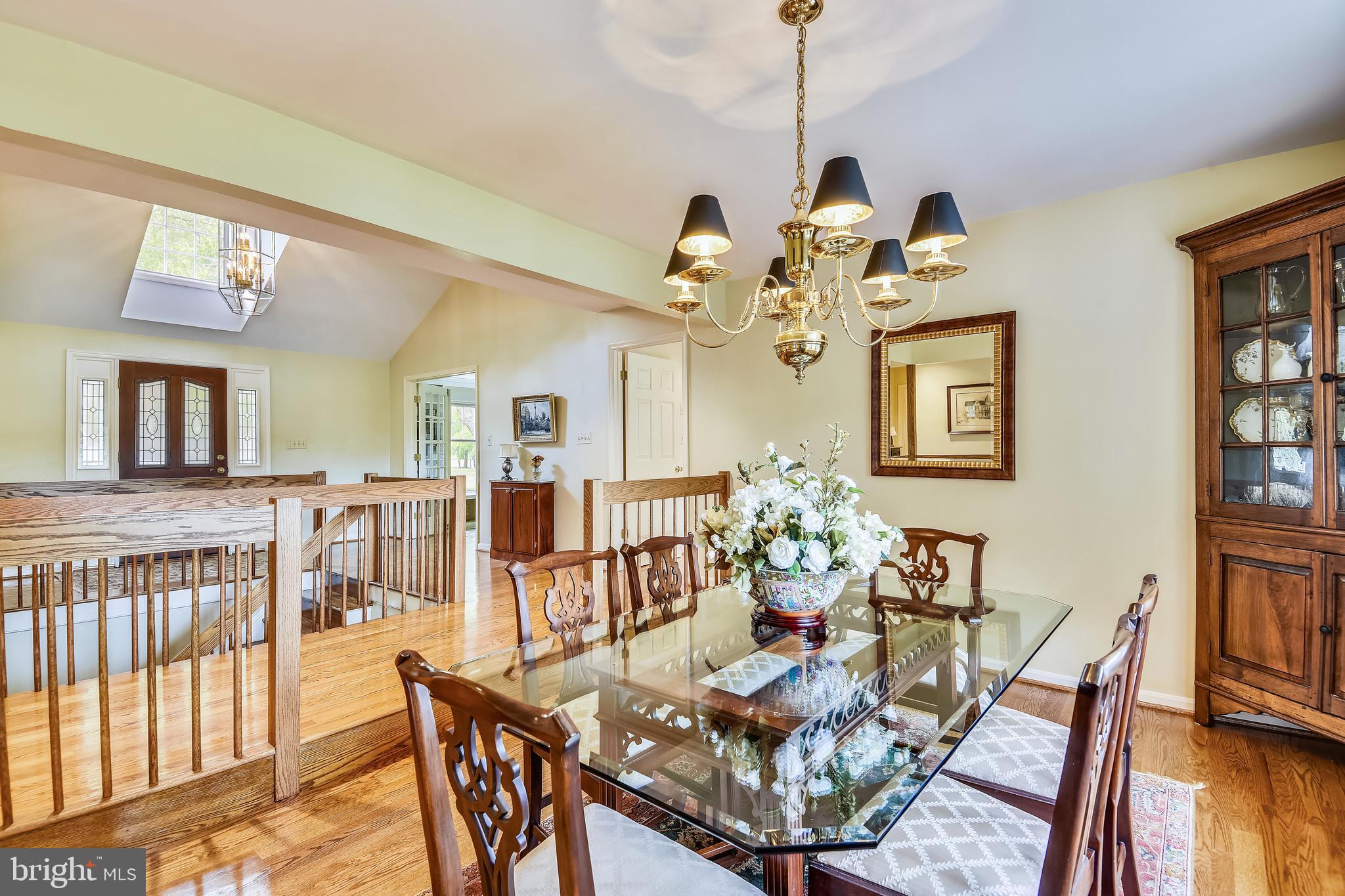 970 South River Landing Road Edgewater, MD 21037 - Photo 13 of 44 a view of a dining room with furniture a chandelier and wooden floor