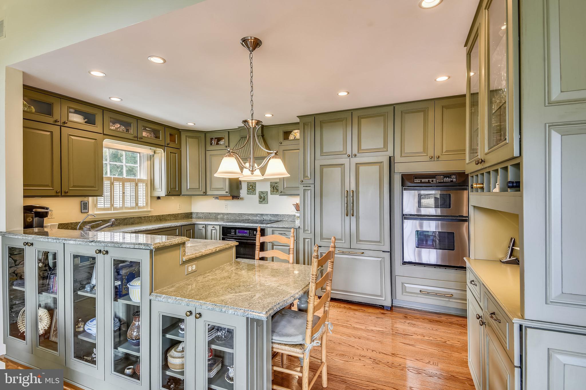 970 South River Landing Road Edgewater, MD 21037 - Photo 14 of 44 a kitchen with stainless steel appliances granite countertop a stove refrigerator and cabinets