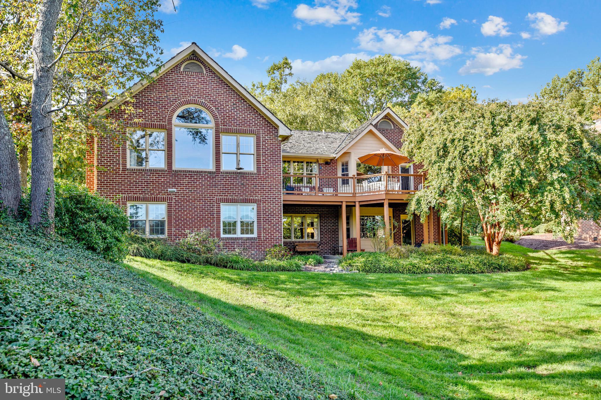 970 South River Landing Road Edgewater, MD 21037 - Photo 5 of 44 a front view of a house with a garden
