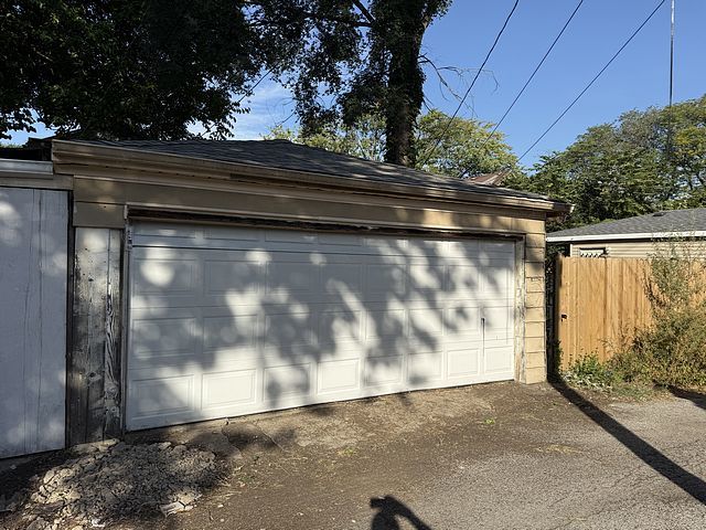 7711 South Champlain Avenue Chicago, IL 60619 - Photo 19 of 19 a view of backyard with wooden fence