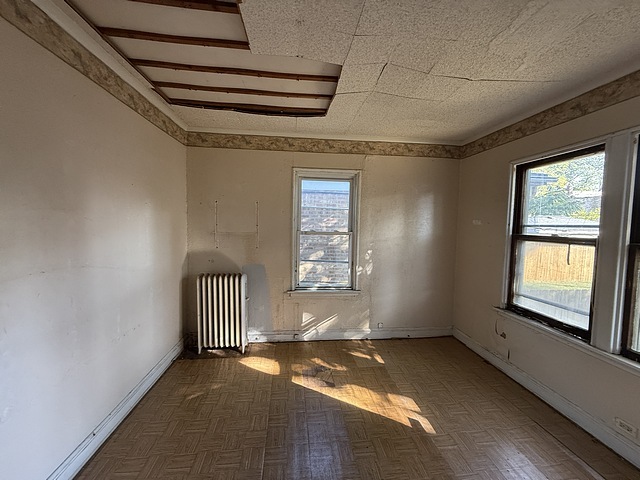 7711 South Champlain Avenue Chicago, IL 60619 - Photo 6 of 19 a view of empty room with windows