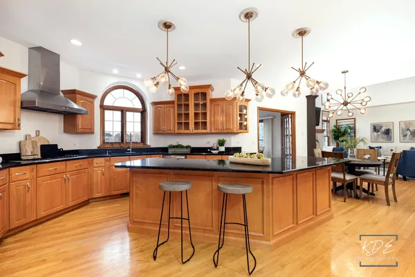 a kitchen with stainless steel appliances granite countertop a stove a sink and a granite counter tops