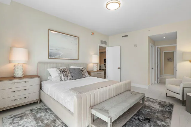 a bedroom with a bed and a couch