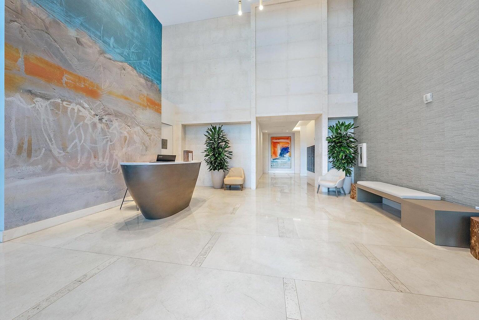 3100 North Ocean Drive, Unit H1205 Singer Island, FL 33404 - Photo 30 of 35 a living room with furniture a rug and a potted plant