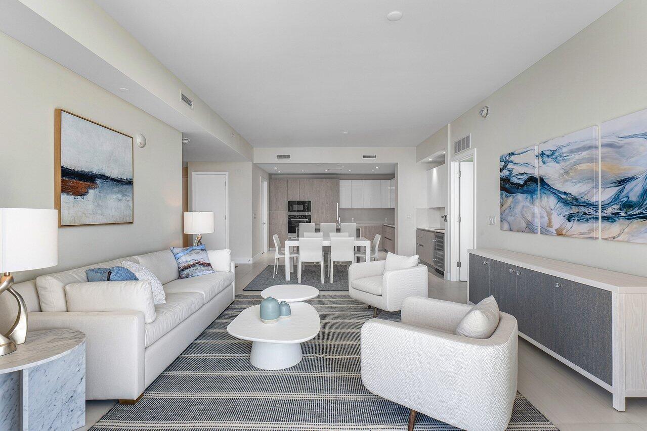 3100 North Ocean Drive, Unit H1205 Singer Island, FL 33404 - Photo 10 of 35 a living room with furniture and a wooden floor