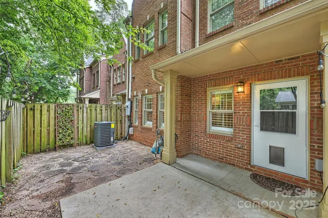 a view of a house with a backyard of the house