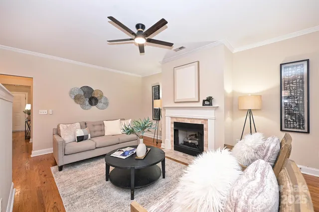 a living room with furniture and a fireplace