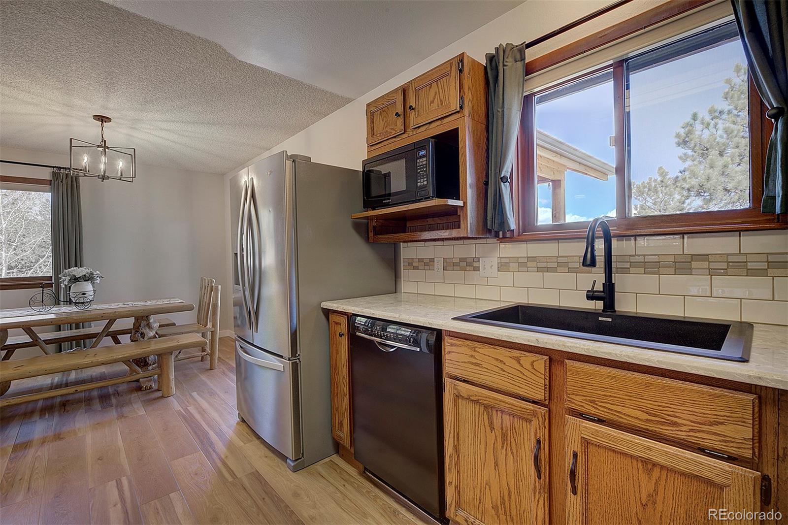 81 Fir Lane Bailey, CO 80421 - Photo 13 of 33 a kitchen with stainless steel appliances a refrigerator and a stove