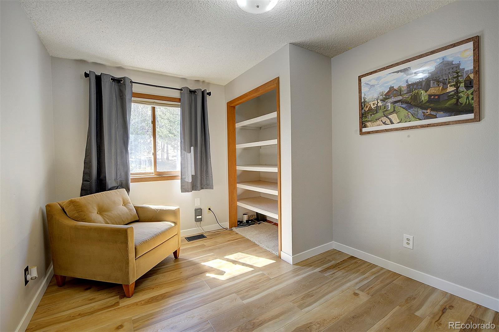 81 Fir Lane Bailey, CO 80421 - Photo 15 of 33 a living room with furniture and a window