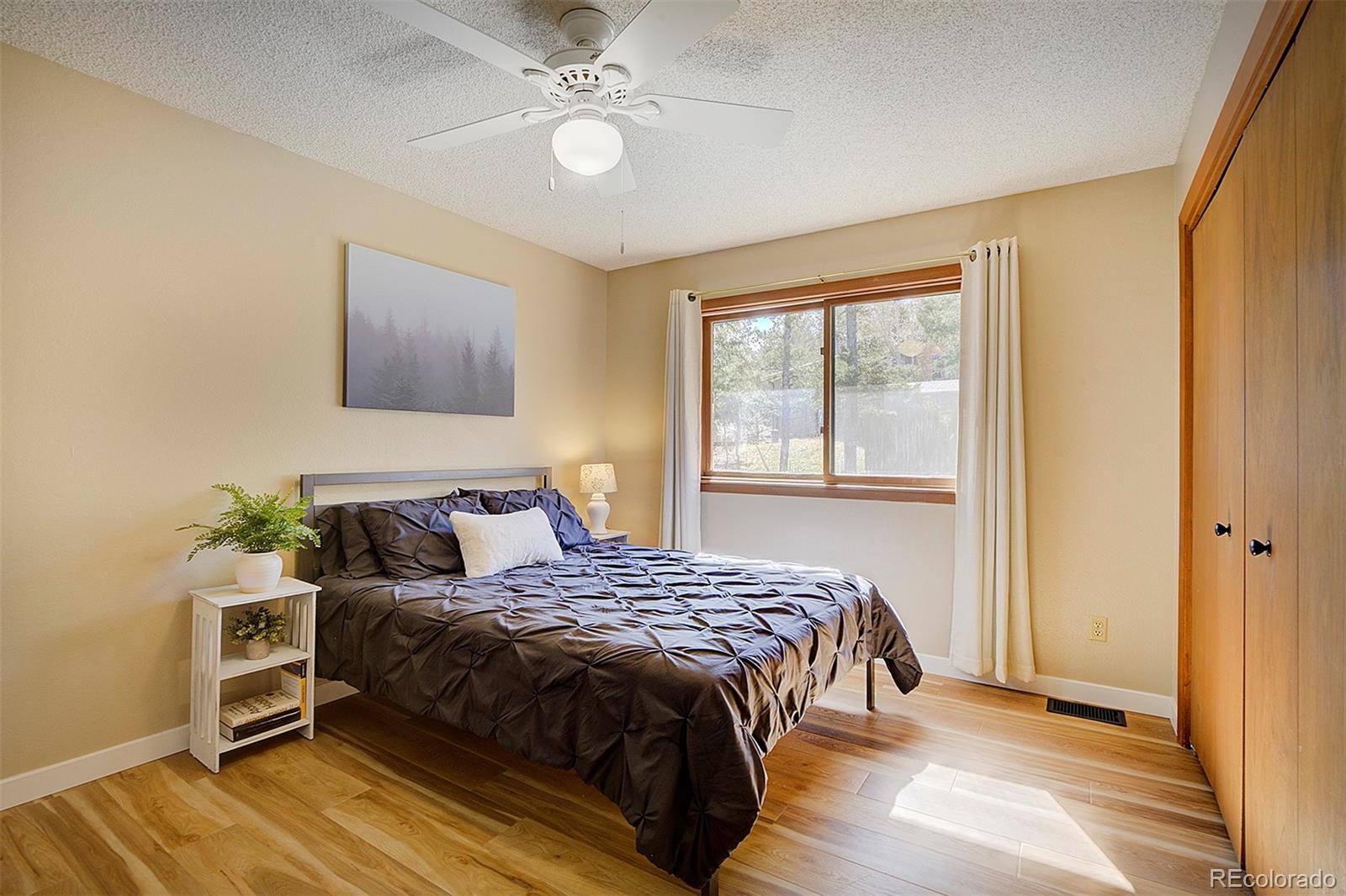 81 Fir Lane Bailey, CO 80421 - Photo 17 of 33 a bedroom with a bed and a window