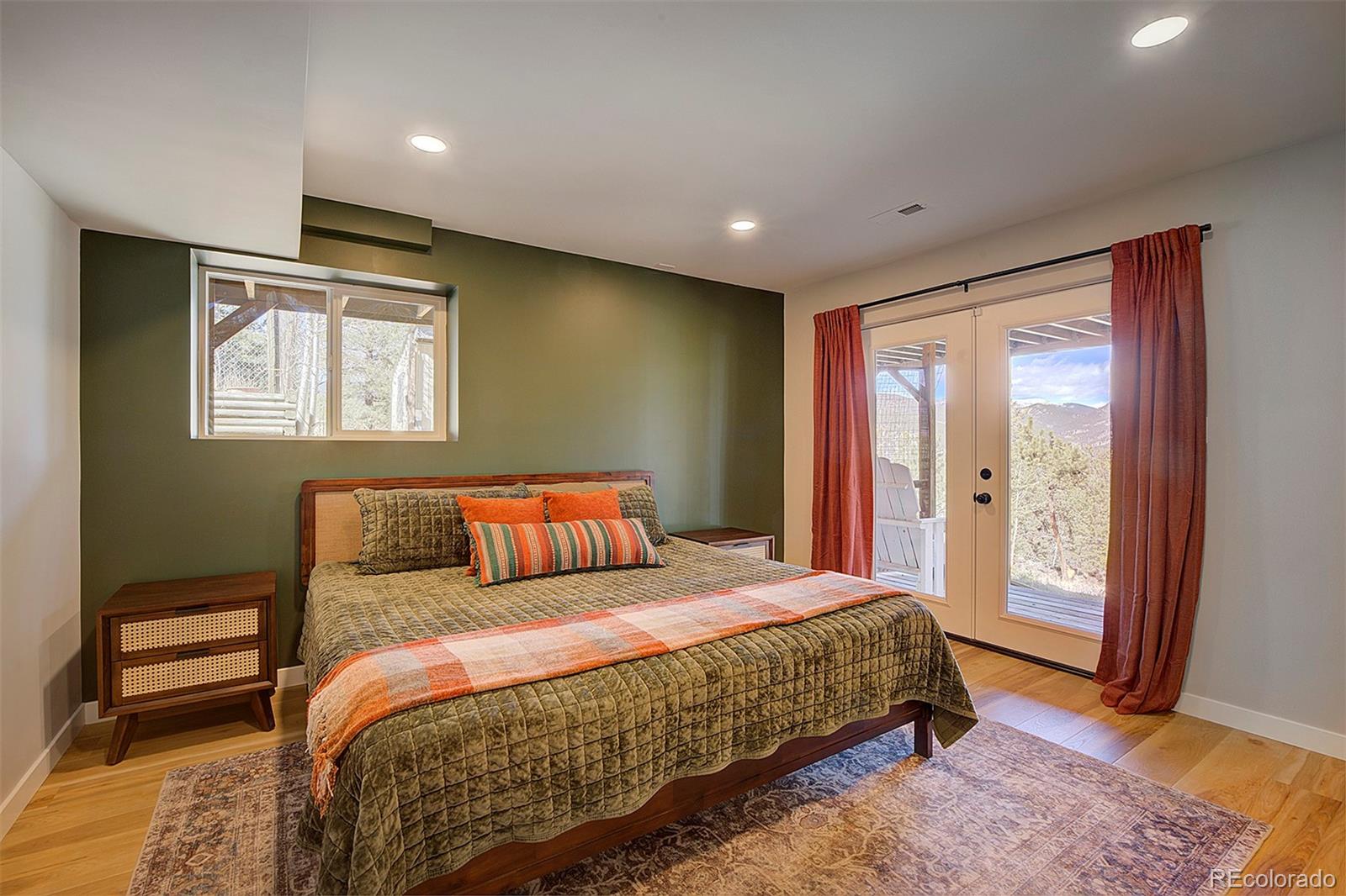 81 Fir Lane Bailey, CO 80421 - Photo 19 of 33 a bedroom with a large bed and a window