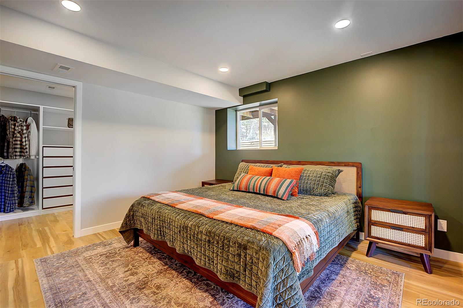 81 Fir Lane Bailey, CO 80421 - Photo 20 of 33 a bedroom with a bed and a night stand