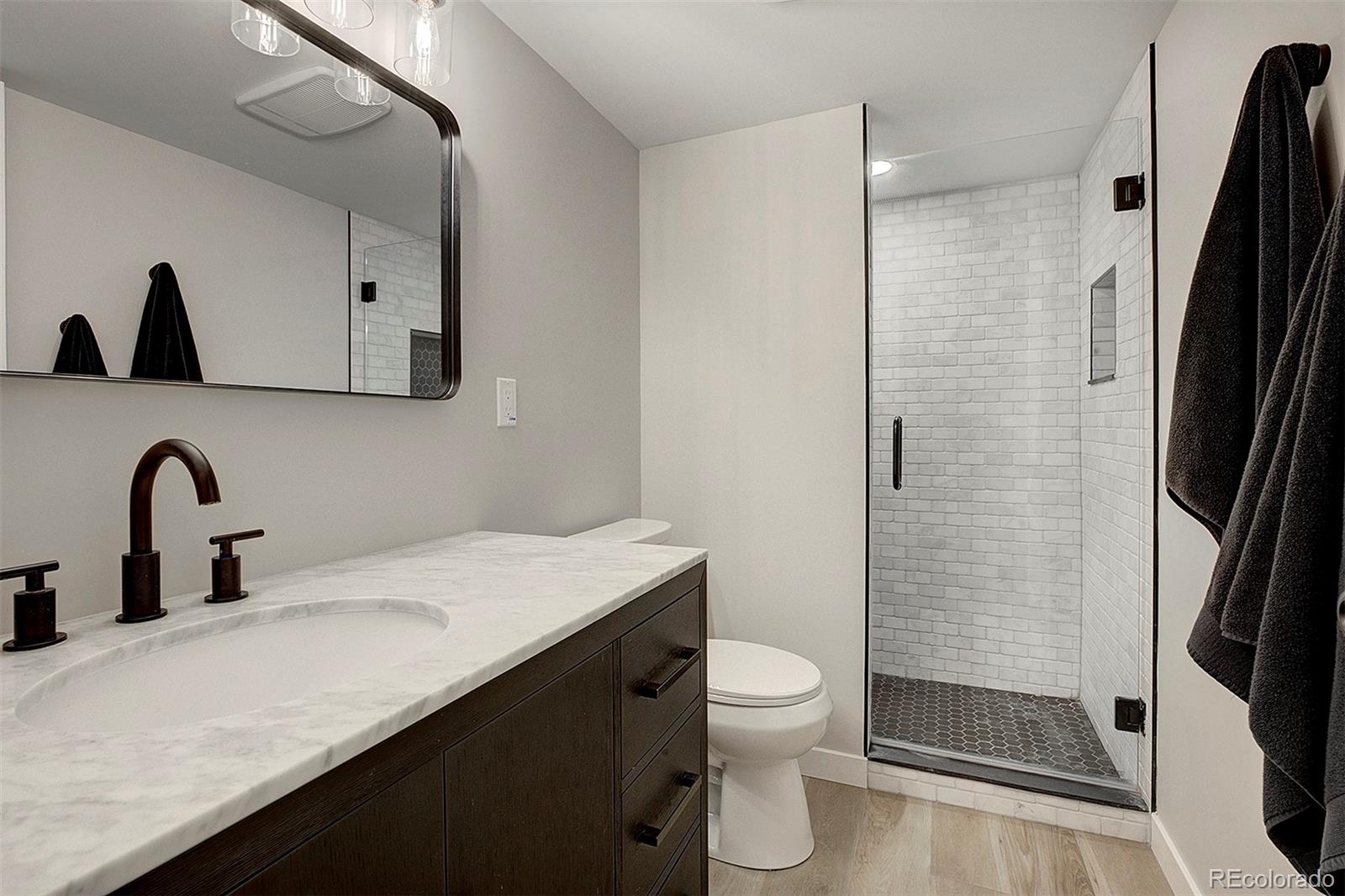 81 Fir Lane Bailey, CO 80421 - Photo 22 of 33 a bathroom with a sink a toilet and shower