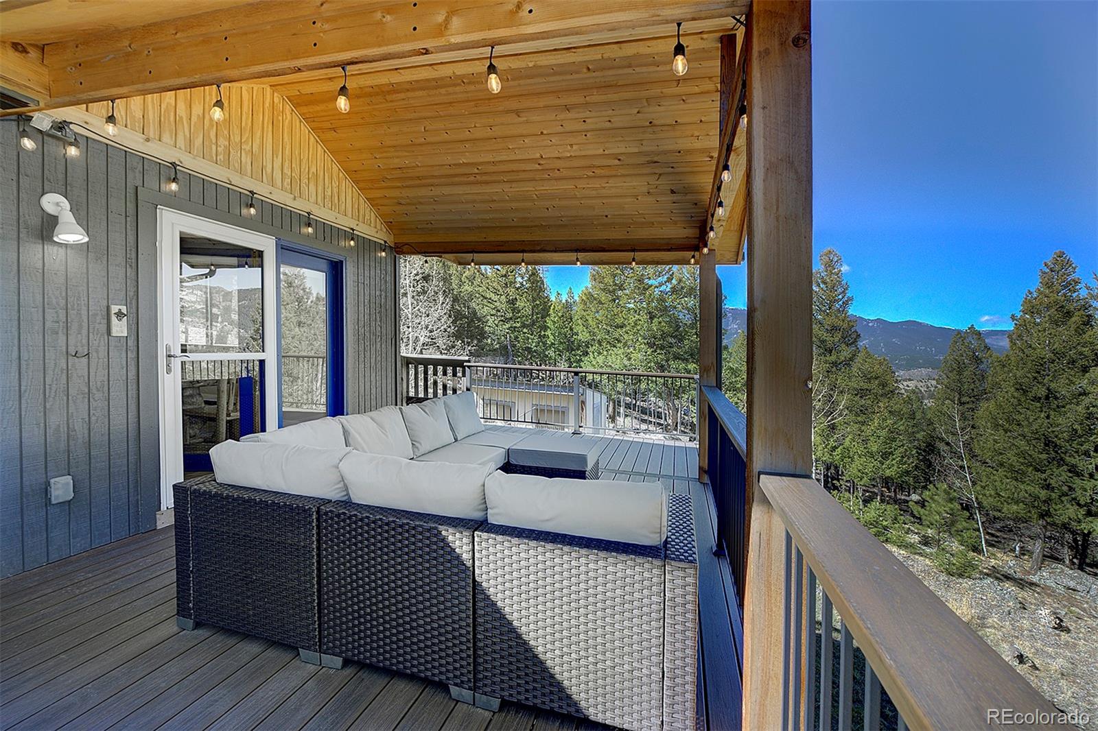 81 Fir Lane Bailey, CO 80421 - Photo 24 of 33 a balcony with furniture and wooden floor