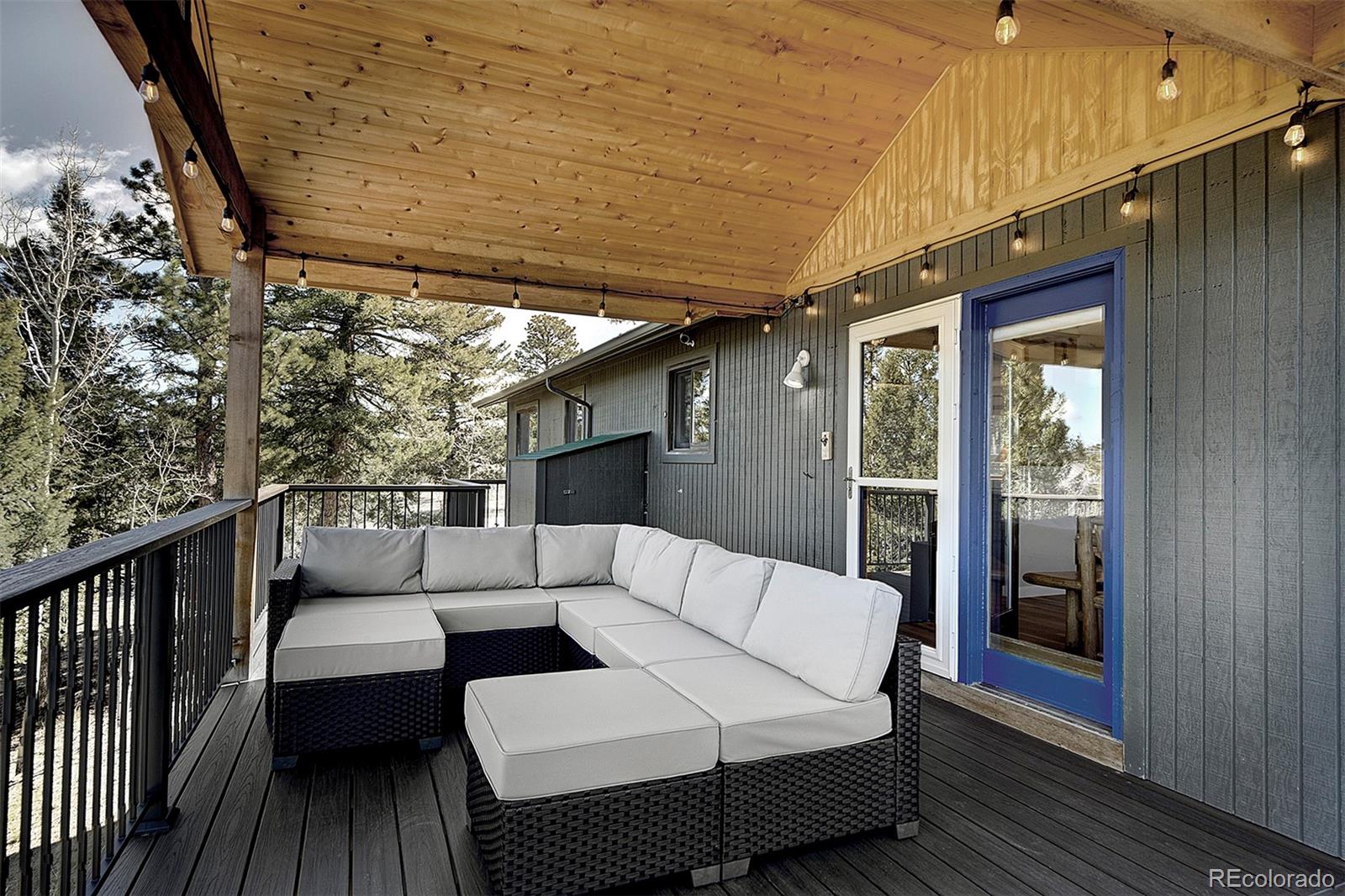 81 Fir Lane Bailey, CO 80421 - Photo 26 of 33 a balcony with furniture and wooden floor