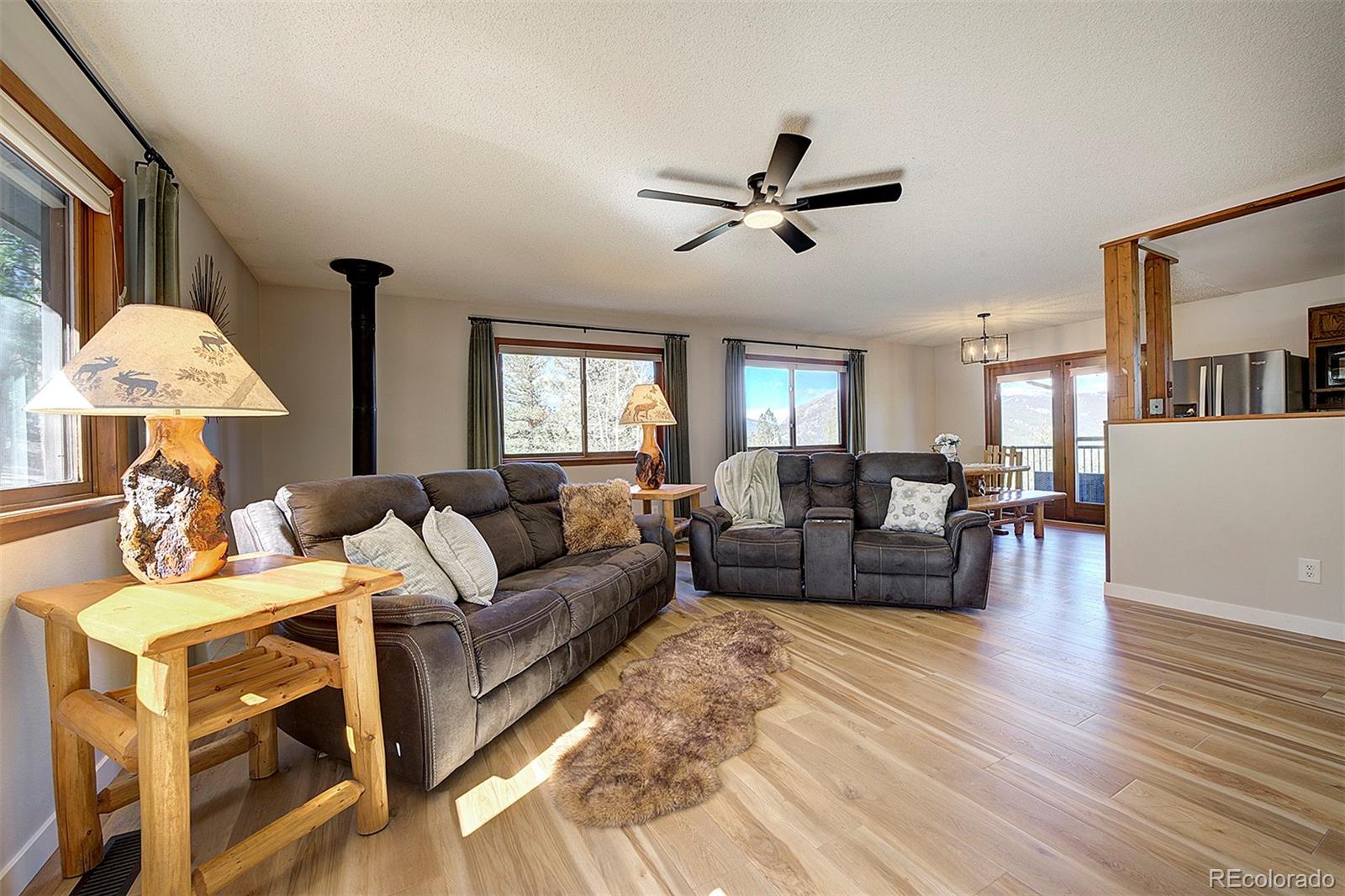81 Fir Lane Bailey, CO 80421 - Photo 7 of 33 a living room with furniture and a wooden floor