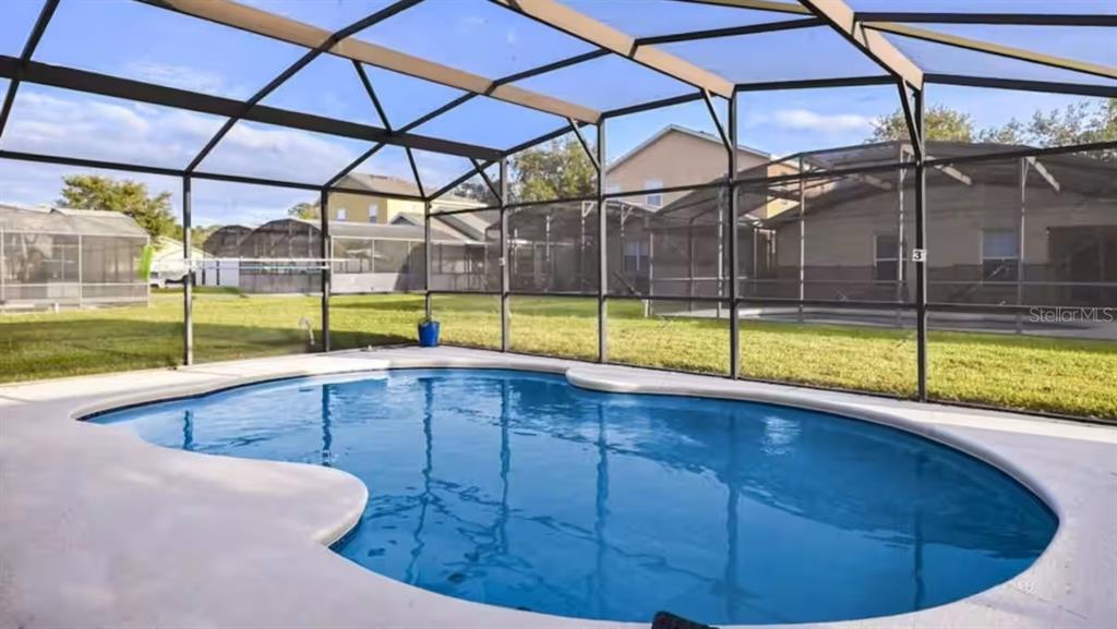 1904 Royal Ridge Drive Davenport, FL 33896 - Photo 13 of 15 a view of a swimming pool with a yard