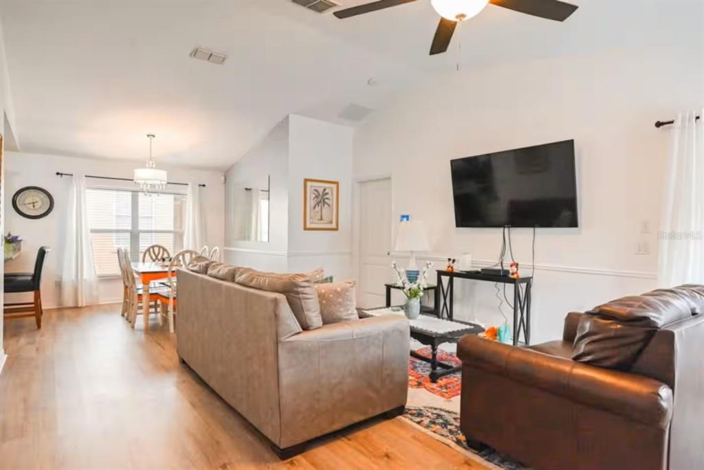 1904 Royal Ridge Drive Davenport, FL 33896 - Photo 2 of 15 a living room with furniture and a flat screen tv