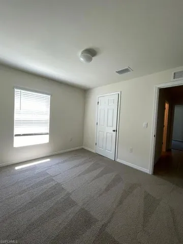 an empty room with window